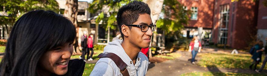 SPU students walk across campus together on a sunny fall day