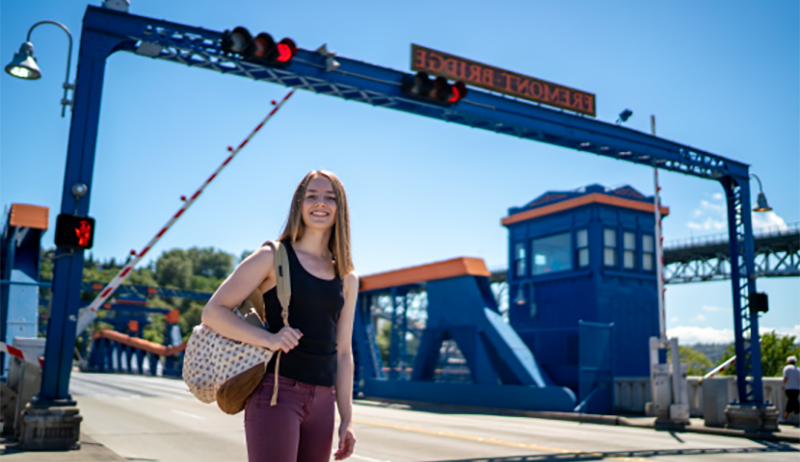 Female student on the Fremont Bridge in Seattle, near SPU